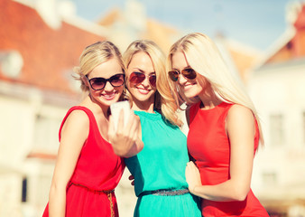 Wall Mural - beautiful girls taking picture in the city