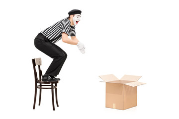 Poster - Mime artist jumping in an empty box