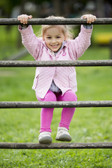 Wall Mural - Little girl at the playground