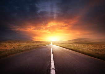 road leading into a sunset
