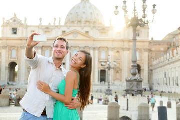 Tourists couple by Vatican city in Rome