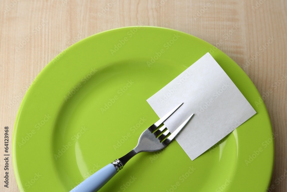 Empty note paper attached to fork,