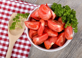 Canvas Print - tomatoes cut into wedges in a bowl