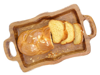 Sweet braided brioche bread on tray isolated on white