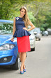 Beautiful girl in a blue blouse and red skirt