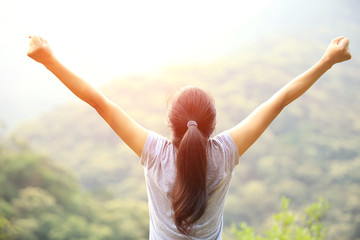 Sticker - cheering hiking woman enjoy the beautiful view at mountain peak