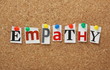 The word Empathy on a cork notice board