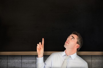 Poster - Composite image of business manager pointing