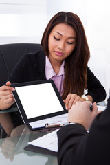 Poster - Businesswoman Showing Digital Tablet To Colleague