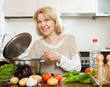 © JackF - Mature woman cooking  soup