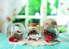 Assortment Of Herbs And Tea In Glass Jars