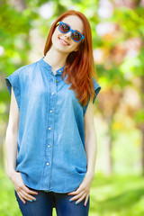 Sticker - Redhead girl in the park in spring time.