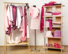 Dressing Closet With Pink Clothes On Hangers,shelf And Mannequin