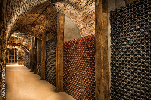 Nowoczesny obraz na płótnie Wine cellar, a row of champagne bottles