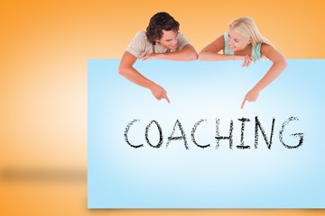 Poster - Attractive couple showing card with coaching