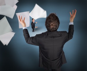 Poster - Composite image of gesturing businessman with tiny businessman