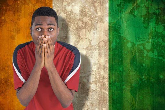 Composite image of nervous football fan looking ahead