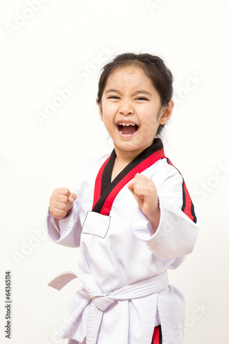 Little asian child in fighting action on isolated background Fototapete