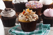 Assorted Fancy Gourmet Cupcakes With Frosting