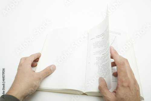 Hand Turning Pages In A Book Stock Photo Adobe Stock