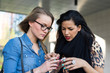 © pio3 - Young women using mobile phone.