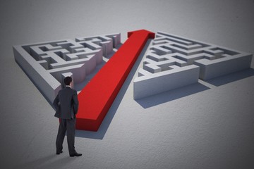 Poster - Composite image of businessman standing with hands on hips