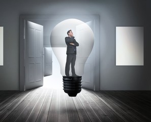 Poster - Composite image of thinking businessman in light bulb