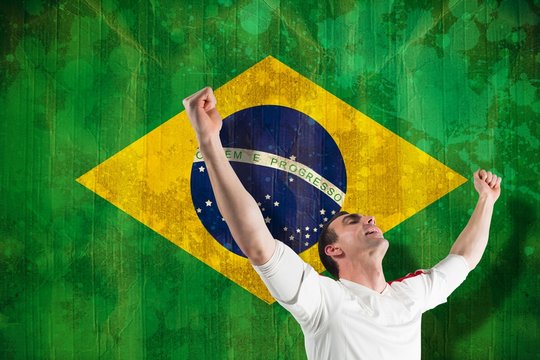Composite image of excited football fan cheering