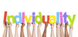 Multiethnic Group of Hands Holding Word Individuality
