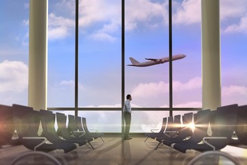 Poster - Composite image of serious businessman with hand on hip