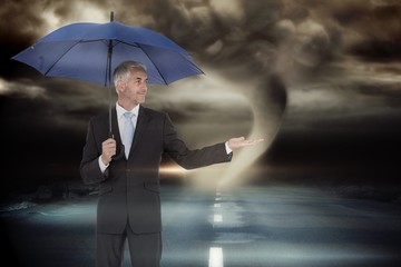 Poster - Composite image of happy businessman holding umbrella