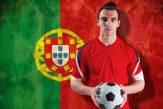 Handsome football fan looking at camera