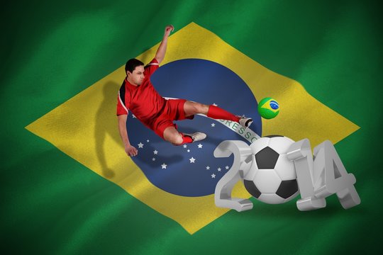 Fit football player jumping and kicking
