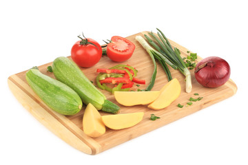 Canvas Print - Composition of vegetables on wooden platter.