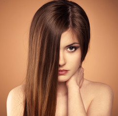 Hair care. Portrait of teenage girl with shiny healthy hair