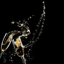 Glasses Of Champagne With Splash, On Black Background