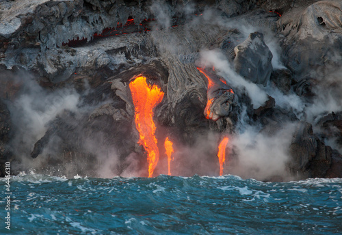 Fotografie, Obraz Red hot lava flowing into Pacific Ocean on Big Island, Hawaii