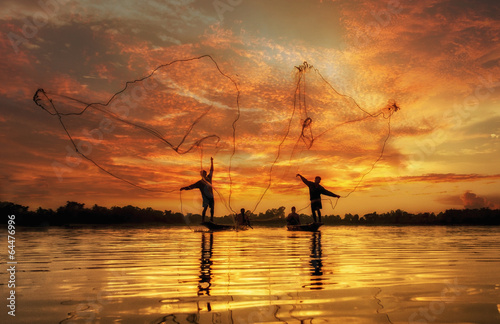 Fotografie, Obraz Fisherman of Lake in action when fishing, Thailand