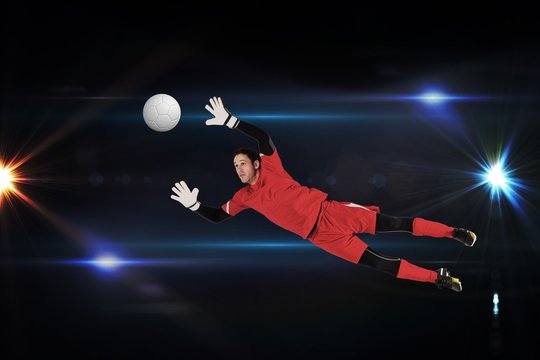 Fit goal keeper jumping up