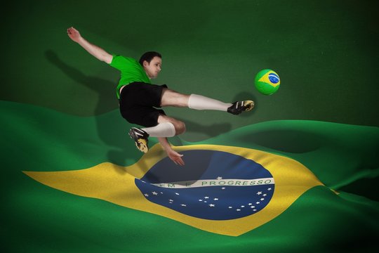 Football player in green kicking