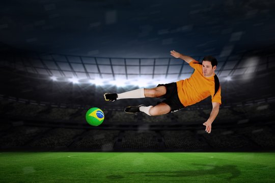Football player in orange jumping