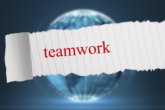 Teamwork against glowing sphere on black background