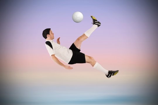 Football player in white kicking