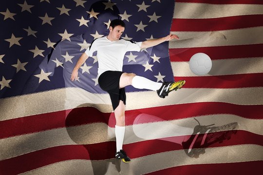 Football player in white kicking