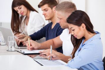 Wall Mural - Businesspeople Working At Desk