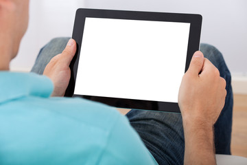 Poster - Man Looking At Blank Screen Of Digital Tablet