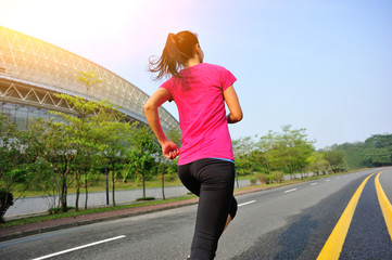 fitness woman running on road