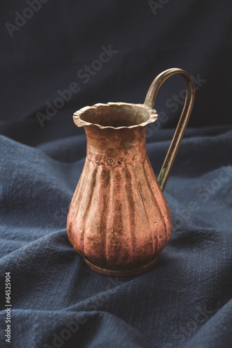 Fototapeta na wymiar Old copper jug