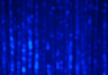 Blue abstract bokeh background with vertical stripes blurred