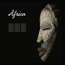 African Mask Over Black Background